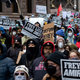 People march at a rally for Amir Locke on Saturday, Feb. 5, 2022, in Minneapolis.